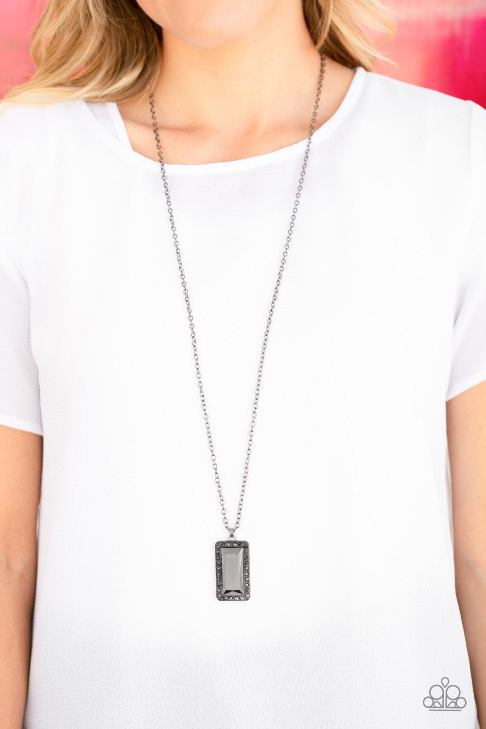 Paparazzi Accessories Bada BLING Bada Boom - Black Featuring a regal emerald style cut, a faceted hematite rhinestone is pressed into the center of a glistening gunmetal frame bordered by dainty hematite rhinestones. The dramatic pendant swings from the b