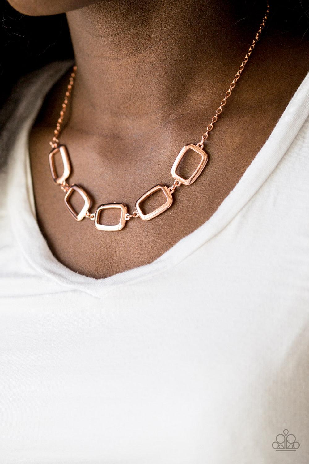 Paparazzi Accessories Gorgeously Geometric - Copper Swinging from the bottom of a shiny copper chain, asymmetrical rectangle frames link below the collar for an edgy geometric look. Features an adjustable clasp closure. Sold as one individual necklace. In