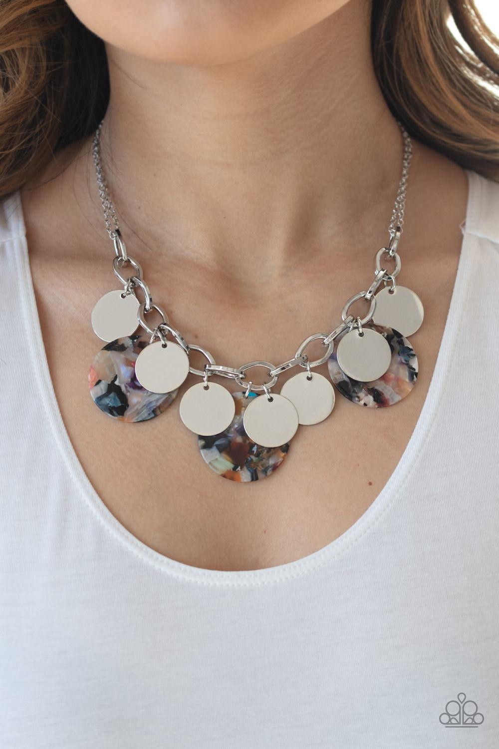 Paparazzi Accessories Confetti Confection - Multi Attached to doubled silver chain, a playful collection of colorful acrylic discs and shiny silver discs swing from the bottom of a bold silver chain, creating a bubbly fringe below the collar. Features an