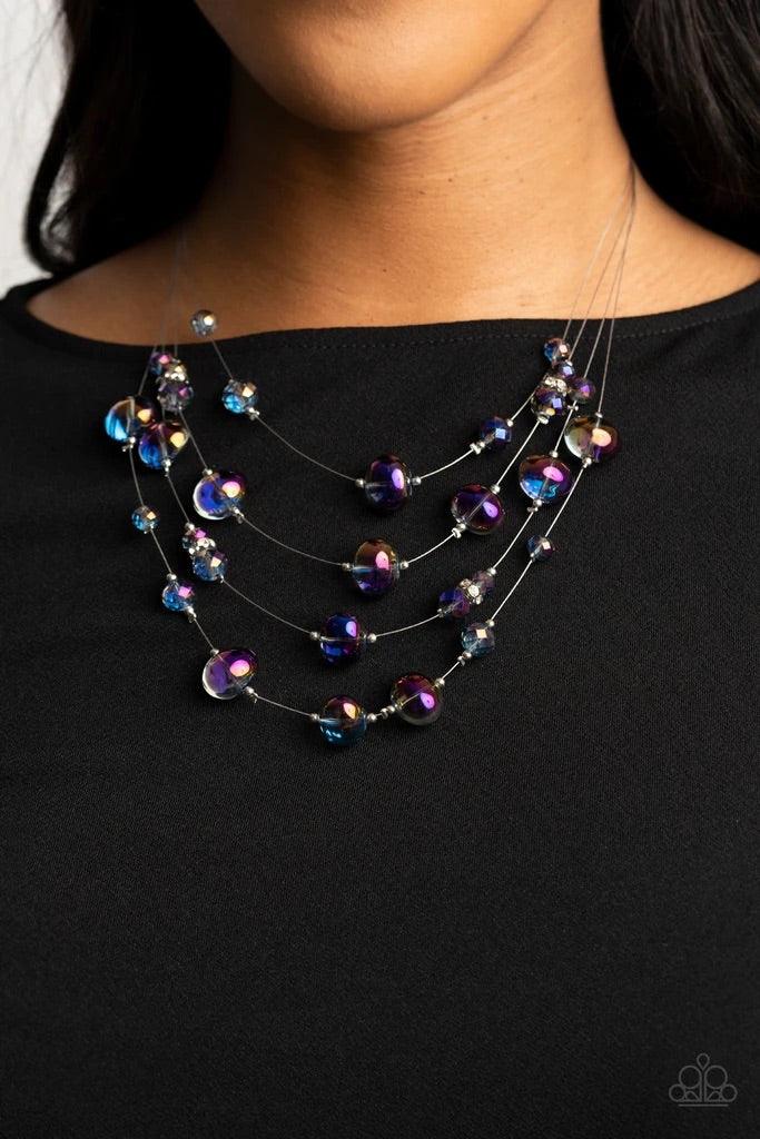 Paparazzi Accessories Cosmic Real Estate - Multi Featuring an oil spill finish, glassy beads and faceted crystal-like accents are fitted in place along dainty wires, creating the illusion of floating layers below the collar. Dainty silver beads and white