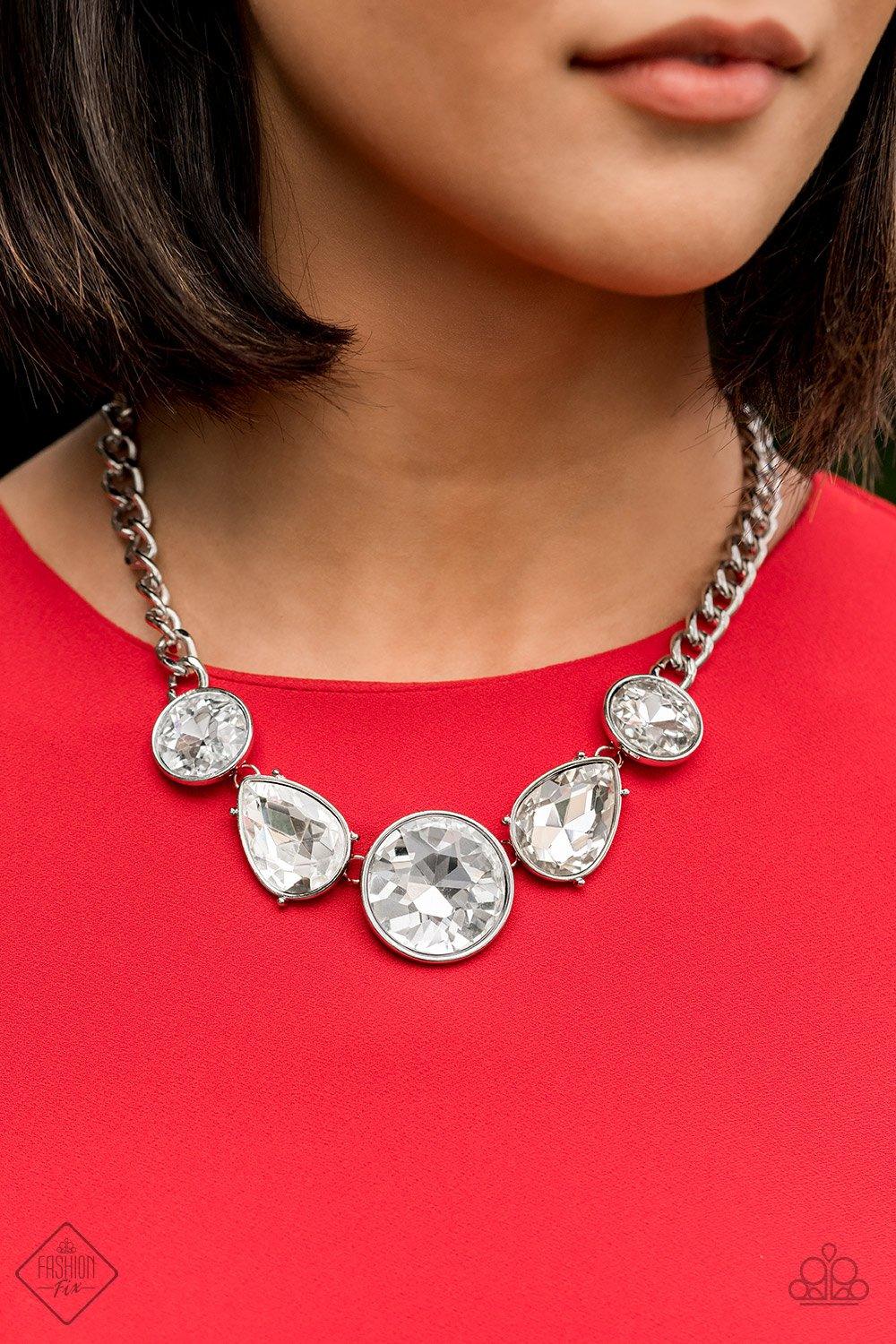 Paparazzi Accessories All The World’s My Stage - White Infused with heavy silver chain, an exaggerated display of round and teardrop-shaped white rhinestones connects below the collar for a blinding look. Features an adjustable clasp closure. Sold as one