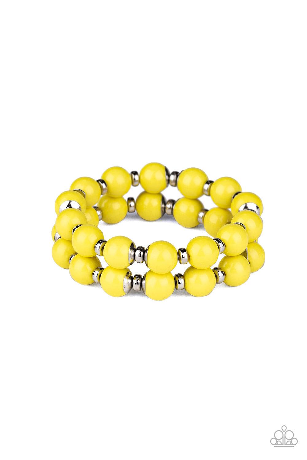Paparazzi Accessories Bubble Blast Off - Yellow Connected together by two dainty silver fittings, a bubbly collection of yellow beads and shiny silver accents are threaded along two stretchy bands around the wrist for a bold pop of color. Jewelry