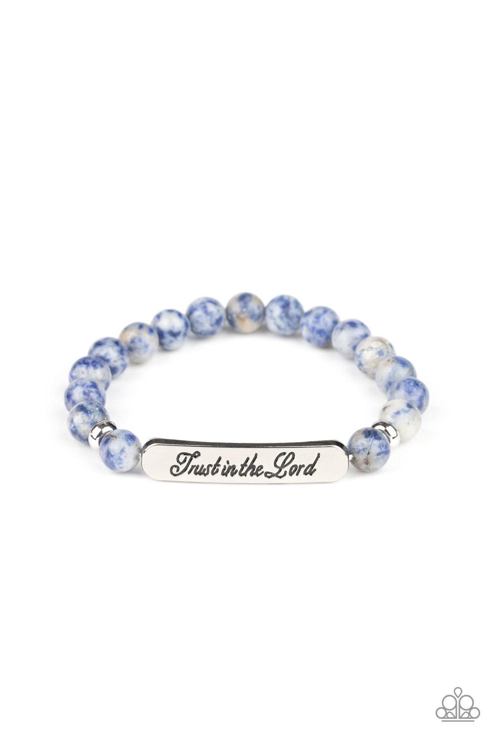 Paparazzi Accessories Keep The Trust - Blue Infused with dainty silver accents, a collection of glassy blue stone beads and a shimmery silver frame stamped in the phrase, "Trust in the Lord", are threaded along a stretchy band around the wrist for an insp