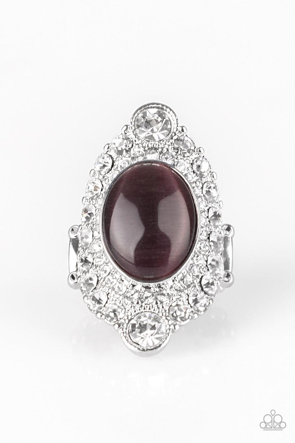 Paparazzi Accessories Riviera Royalty - Purple A glowing purple moonstone is pressed into a dramatic silver band radiating with glassy white rhinestones for a glamorous flair. Features a stretchy band for a flexible fit. Sold as one individual ring. Jewel