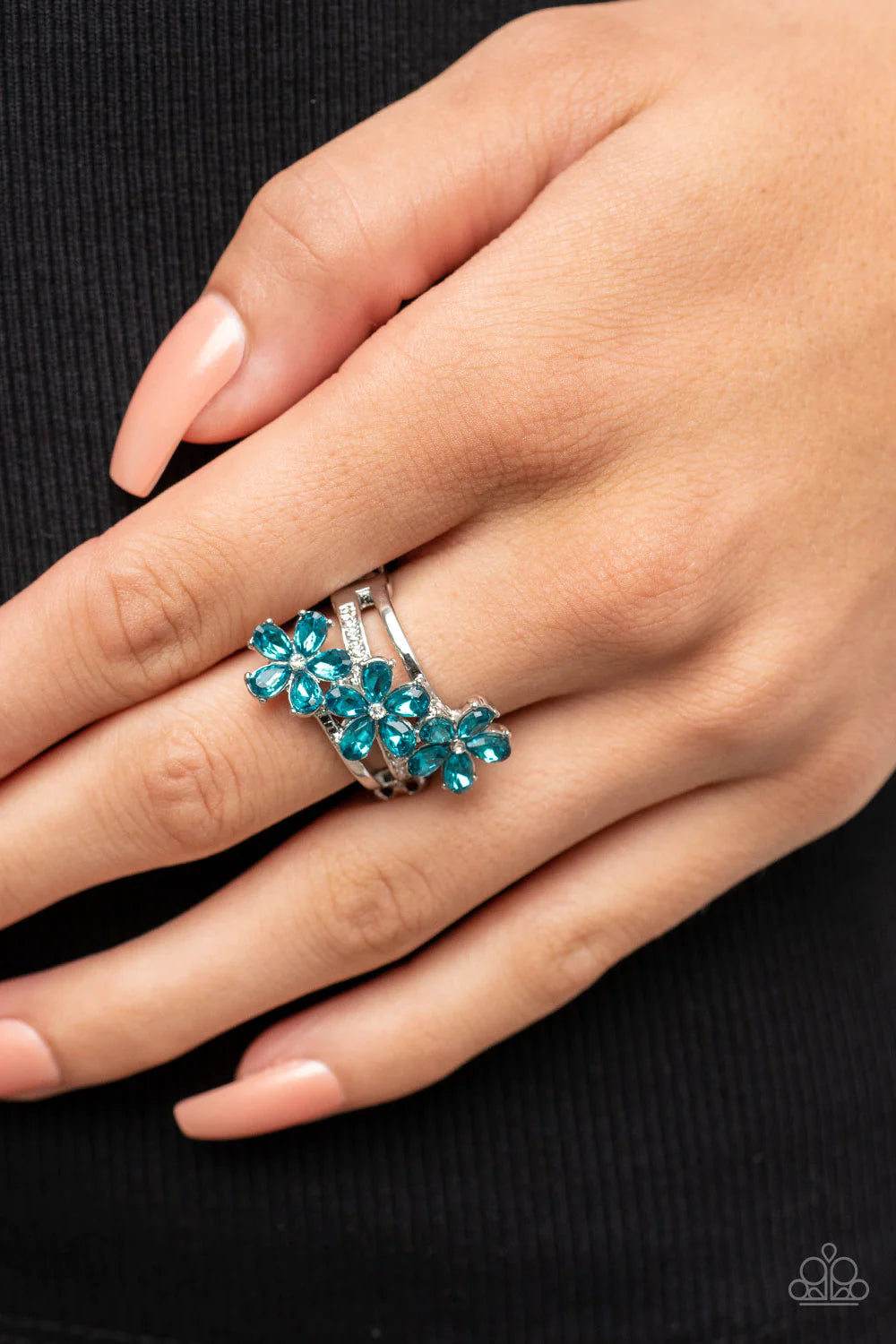 Paparazzi Accessories Posh Petals - Blue Dotted with dainty white rhinestone centers, blue rhinestone petaled floral frames slant across layers of plain silver and white rhinestone encrusted silver bands for a sparkly efflorescence. Features a stretchy ba