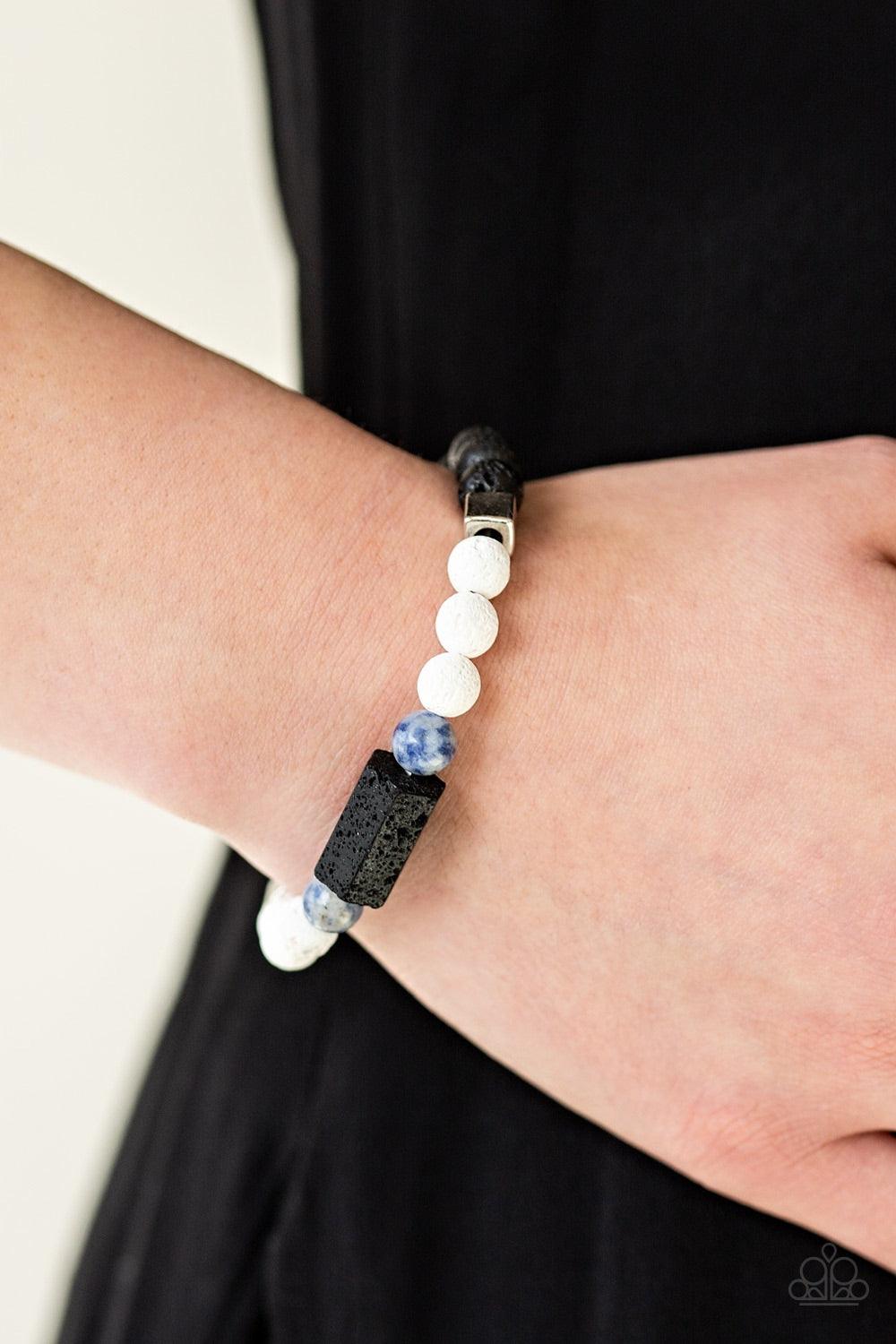 Paparazzi Accessories Run Out The Block - Blue Infused with refreshing blue stone beads, earthy black and white lava rocks are threaded along a stretchy band around the wrist. Block-like metallic and lava beads are added to the seasonal compilation for an