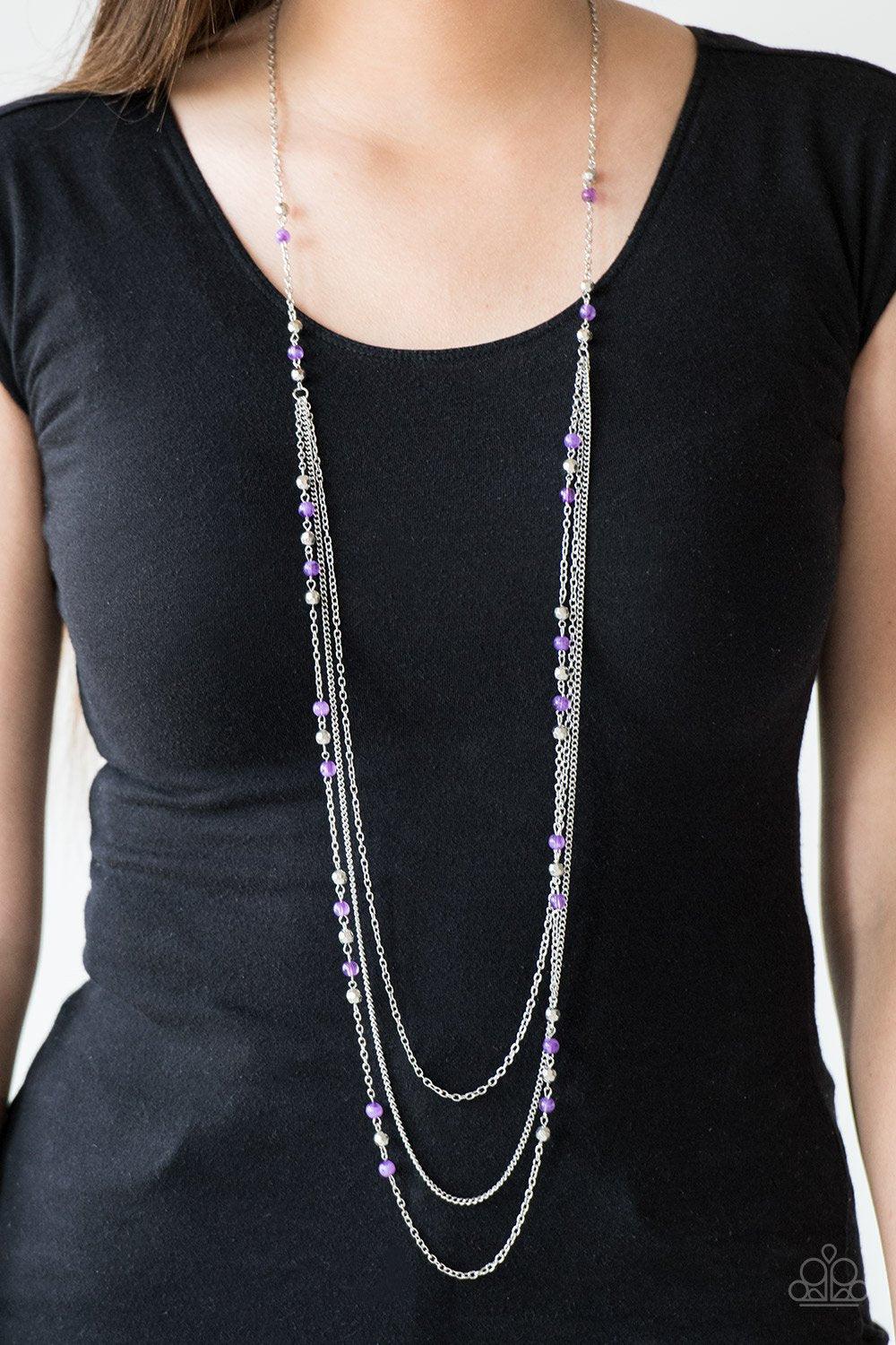Paparazzi Accessories Colorful Cadence - Purple Faceted silver and glassy purple beads trickle along shimmery silver chains down the chest for a whimsical look. Features an adjustable clasp closure. Sold as one individual necklace. Includes one pair of ma