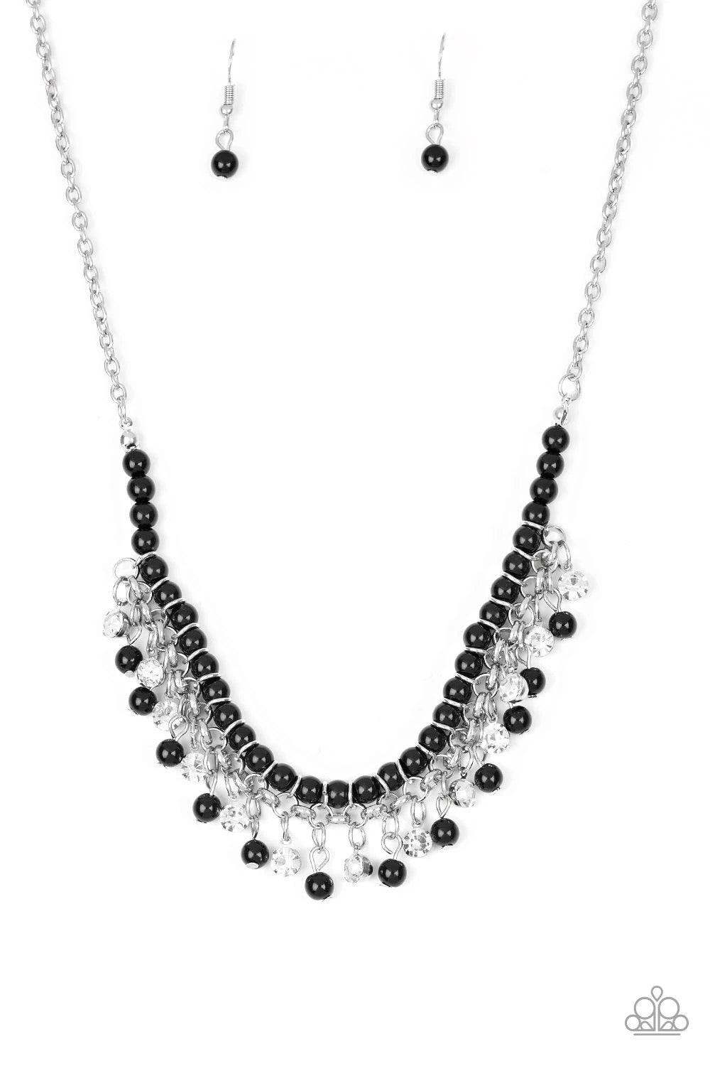 Paparazzi Accessories A Touch of CLASSY - Black Infused with silver chain, shiny black beads are threaded along an invisible wire below the collar. Matching black beads and glittery white rhinestones swing from the pearly strand, creating a flirtatious fr