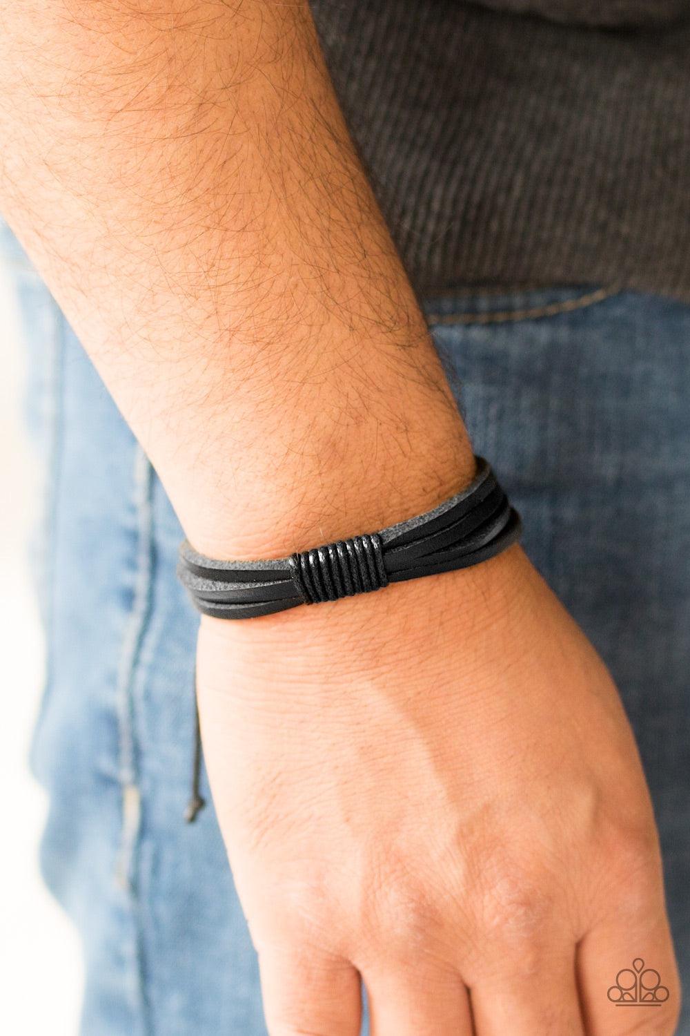 Paparazzi Accessories End of the Road - Black Shiny black cording knots around skinny black leather bands, securing the bands in place for a casual urban look. Features an adjustable sliding knot closure. Jewelry