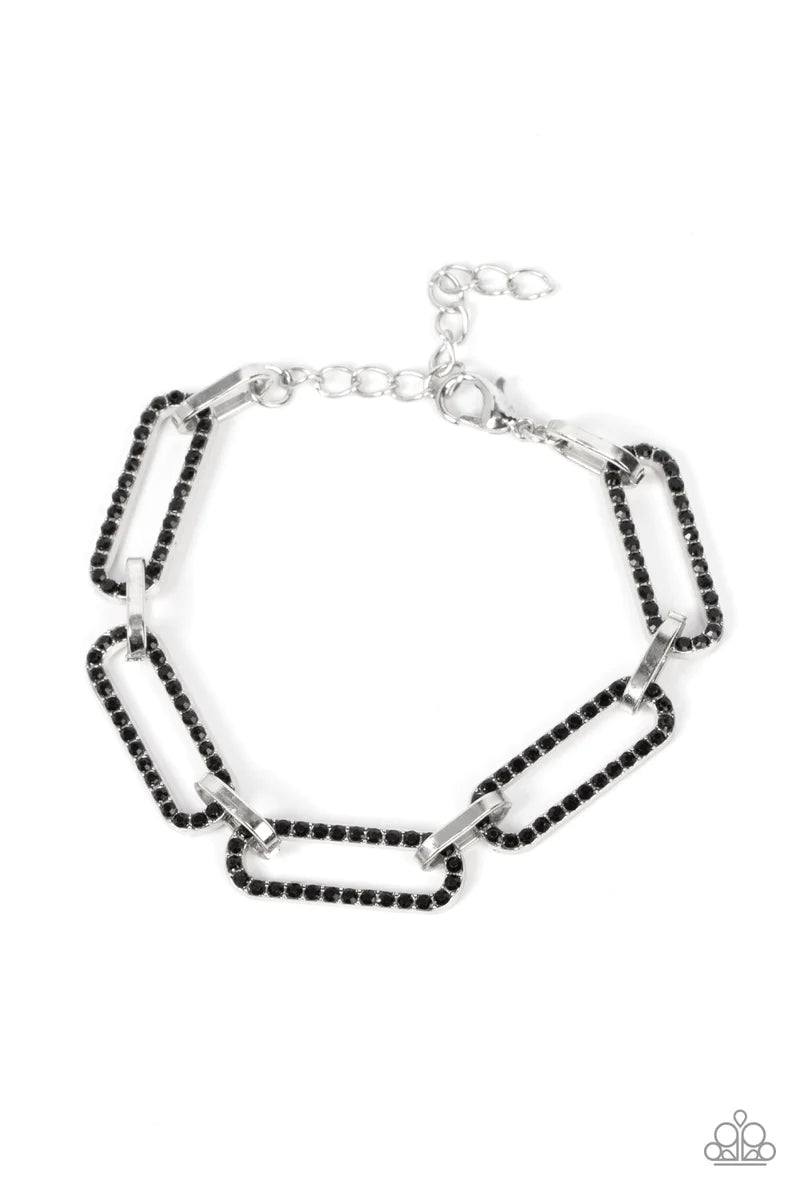 Paparazzi Accessories Still Not OVAL You - Black Dotted in dainty black rhinestones, oblong silver frames link with shiny silver fittings around the wrist for a timeless twinkle. Features an adjustable clasp closure. Sold as one individual bracelet. Jewel