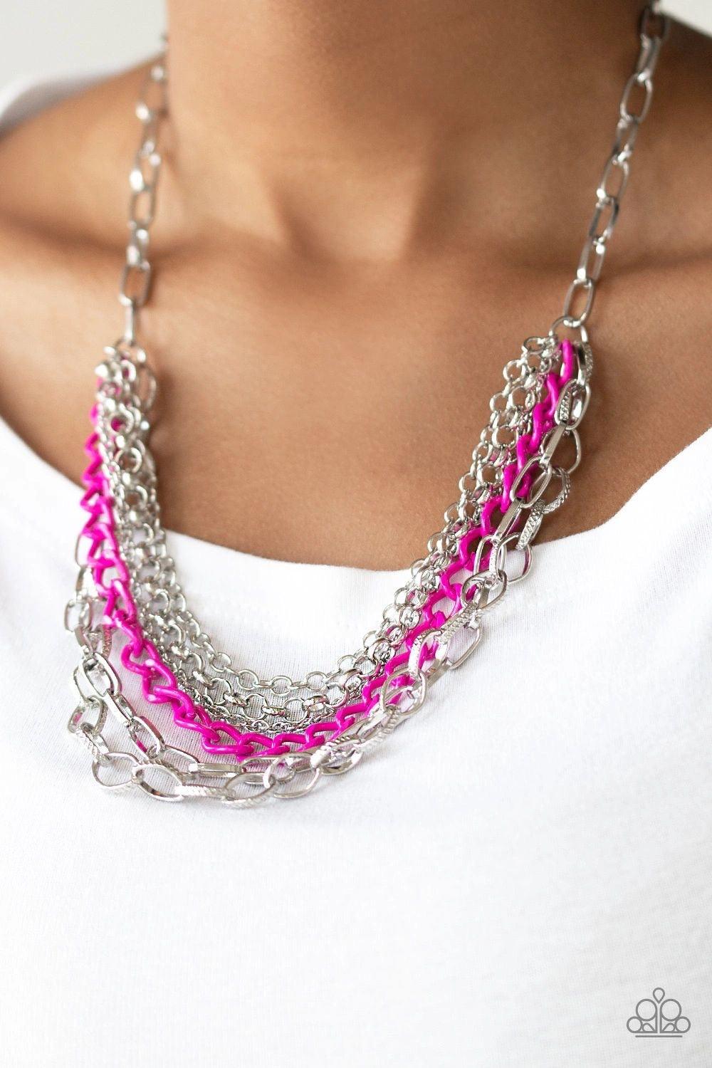 Paparazzi Accessories Color Bomb - Pink Mismatched silver chains layer below the collar for a bold industrial look. Painted in a flirty finish, a shiny pink chain drapes between the shimmery silver chains for a vivacious finish. Features an adjustable cla