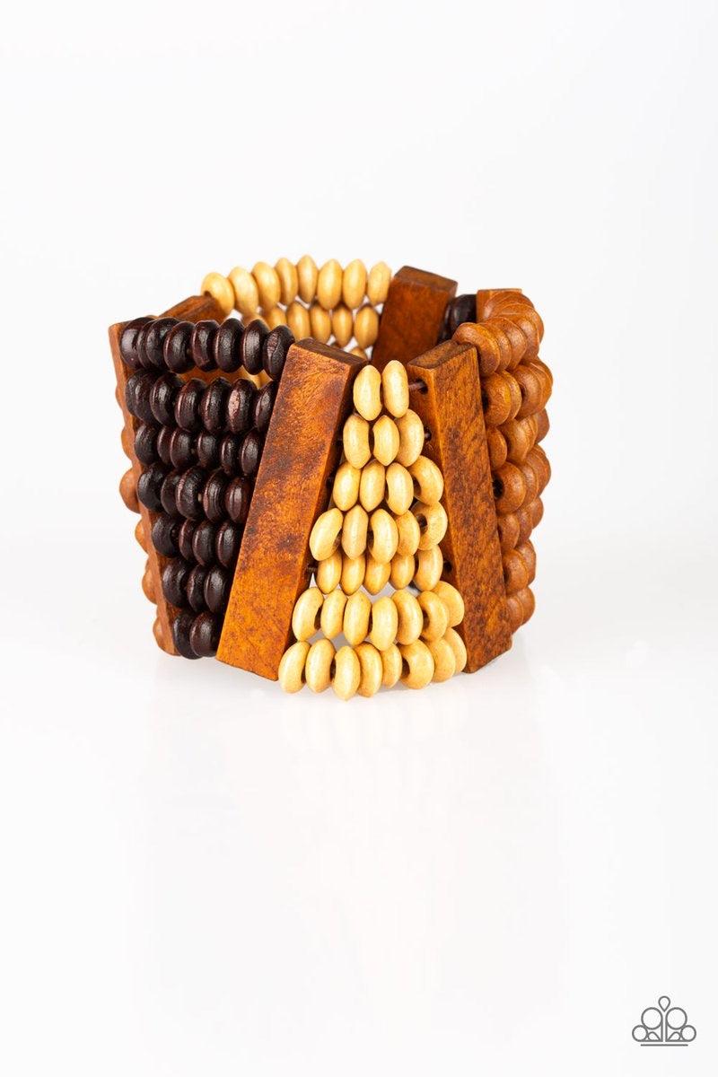 Paparazzi Accessories HAUTE IN Hispaniola - Brown A collection of round and rectangular wooden beads are threaded along stretchy bands, coalescing into an earthy beaded palette for a summery look. Sold as one individual bracelet. Jewelry