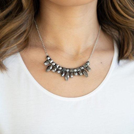 Paparazzi Accessories Wish Upon a ROCK STAR - Silver A collision of round, square, emerald, and marquise cut hematite rhinestones coalesce into a dazzling pendant below the collar for an edgy elegance. Features an adjustable clasp closure. Sold as one ind