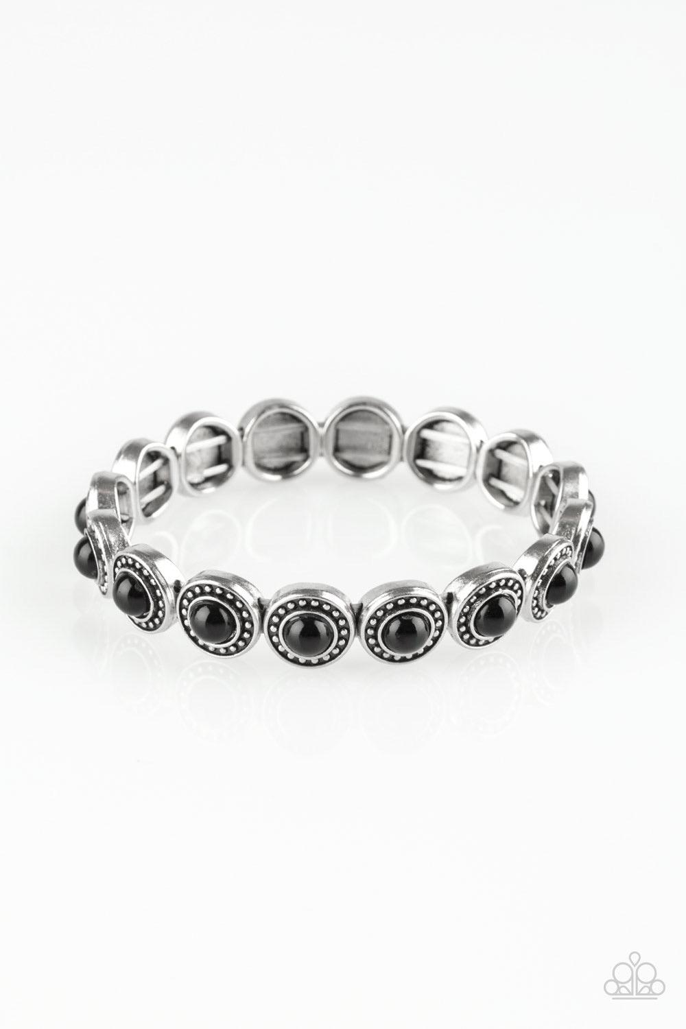 Paparazzi Accessories Globetrotter Goals - Black Dotted with shiny black beaded centers, studded silver frames are threaded along stretchy elastic bands and linked around the wrist for a whimsical look. Sold as one individual bracelet. Jewelry