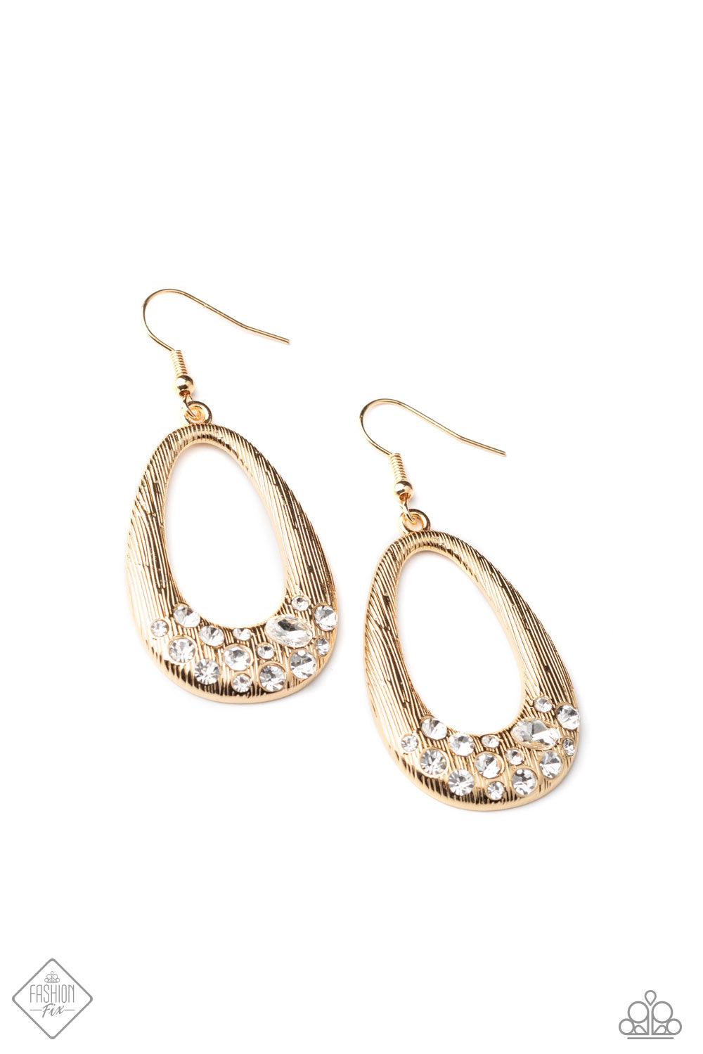 Paparazzi Accessories Better LUXE Next Time - Gold A shimmery gold teardrop featuring a shiny textured surface is dipped in a glittery collection of oval and round white rhinestones for a refined finish. The earring attaches to a standard fishhook fitting
