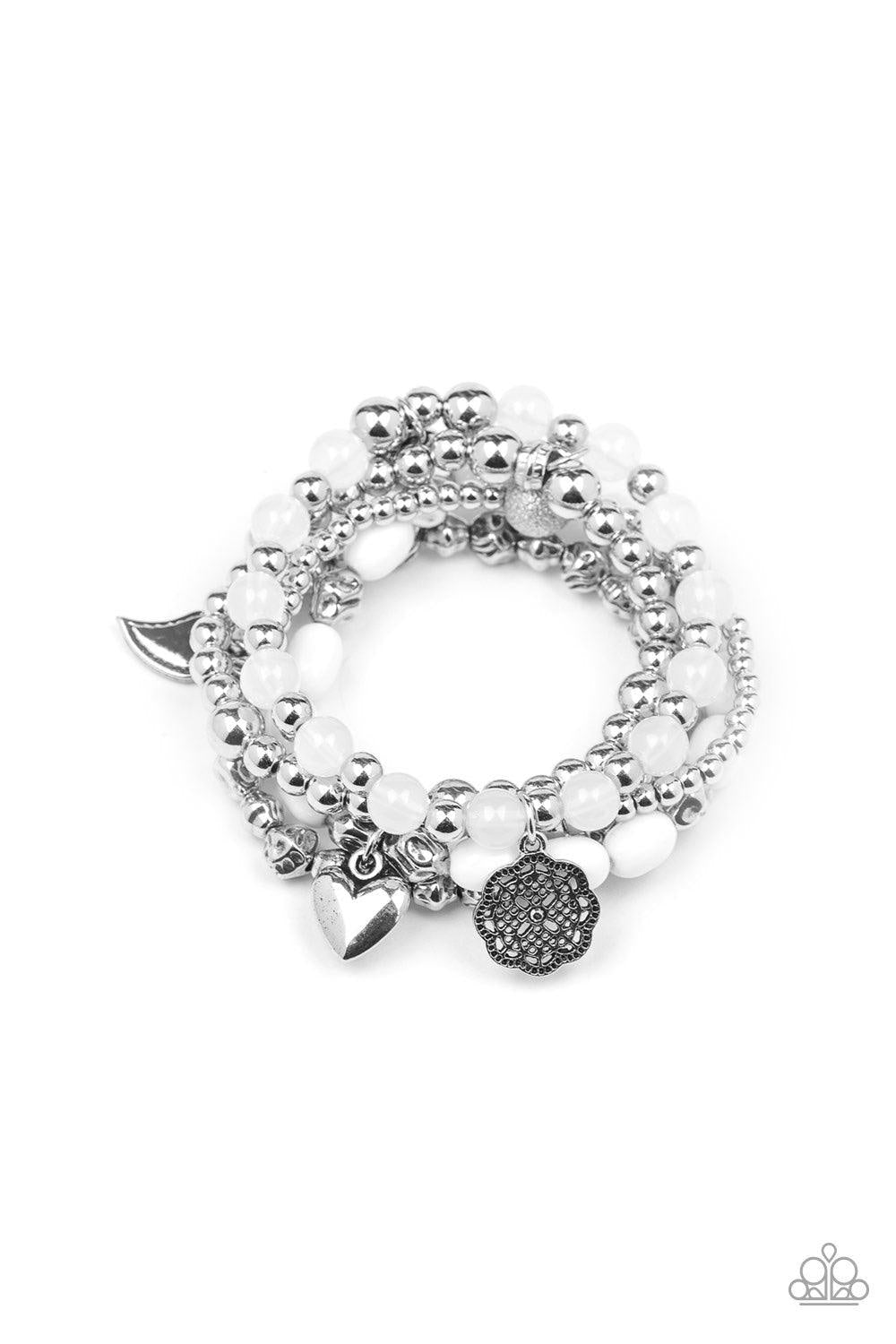 Paparazzi Accessories No CHARM Done - White A mismatched collection of silver charms, cloudy white beads, polished white beads, and shimmery silver beads are threaded along stretchy bands around the wrist for a charmingly layered look. Jewelry