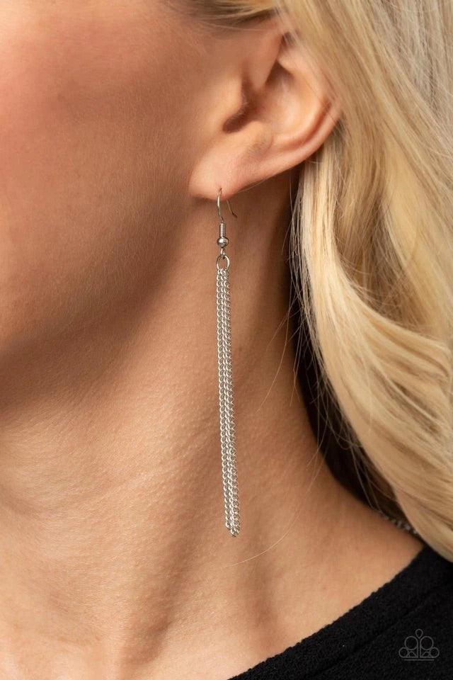 Paparazzi Accessories Radical Refinery- Silver An oversized concave silver disc, ribbed with linear texture, creates a dramatic backdrop for a vertical row of faceted silver beads. A flirty tassel of delicate silver chains sways from the bottom of the pen