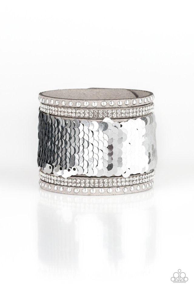 Paparazzi Accessories MERMAIDS Have More Fun - Silver Shiny silver studs, glassy white rhinestones, and shimmering sequins are sprinkled across a thick gray suede band that has been spliced into five glittery rows. Bracelet features reversible sequins tha