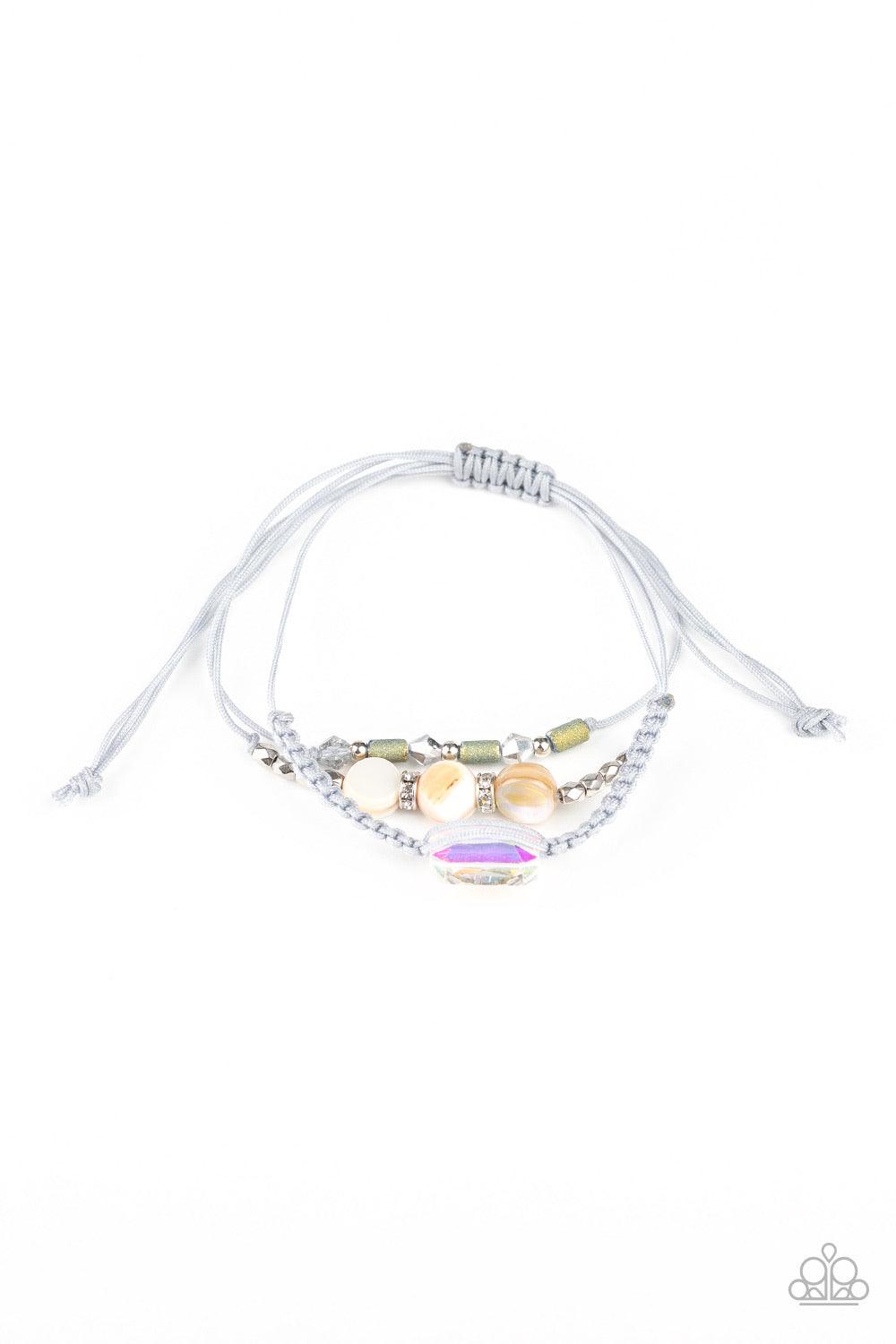 Paparazzi Accessories Prismatic Pathfinder - Multi A collection of shell-like beading, white rhinestone encrusted rings, metallic accents, and an opalescent gem are knotted in place across the wrist for a colorful flair. Features an adjustable sliding kno