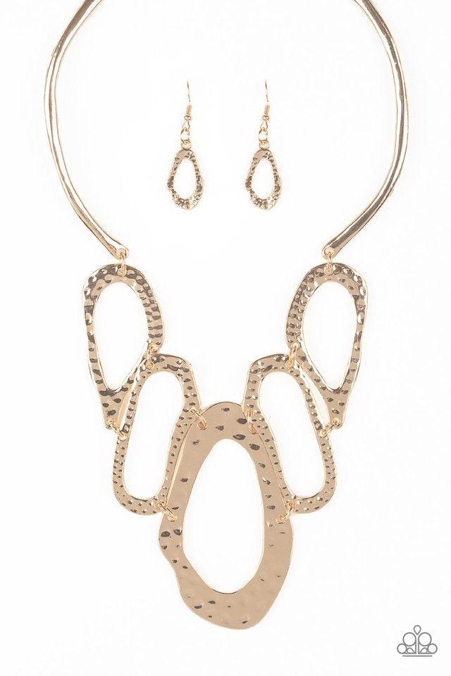 Paparazzi Accessories Prime Prowess - Gold Attached to two bent gold bars, delicately hammered asymmetrical gold hoops link below the collar for an edgy statement making look. Features an adjustable clasp closure. Sold as one individual necklace. Includes
