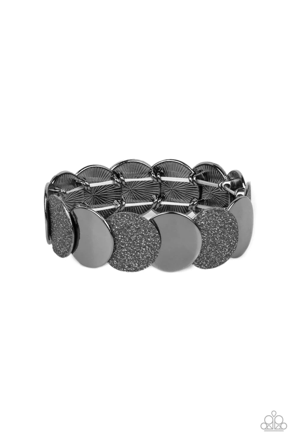 Paparazzi Accessories Demurely Disco - Black A glimmering collection of glistening gunmetal discs and glitter coated gunmetal discs delicately overlap along stretchy bands around the wrist, creating a dazzling hint of shimmer. Sold as one individual brace