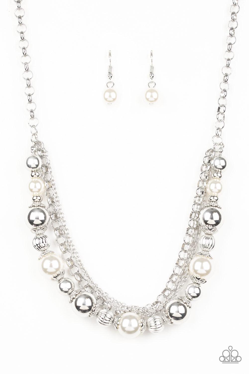 Paparazzi Accessories 5th Avenue Romance - White Layers of mismatched silver chains give way to a strand of ornate silver beads and oversized white pearls that cascade below the collar for a refined flair. Features an adjustable clasp closure. Sold as one
