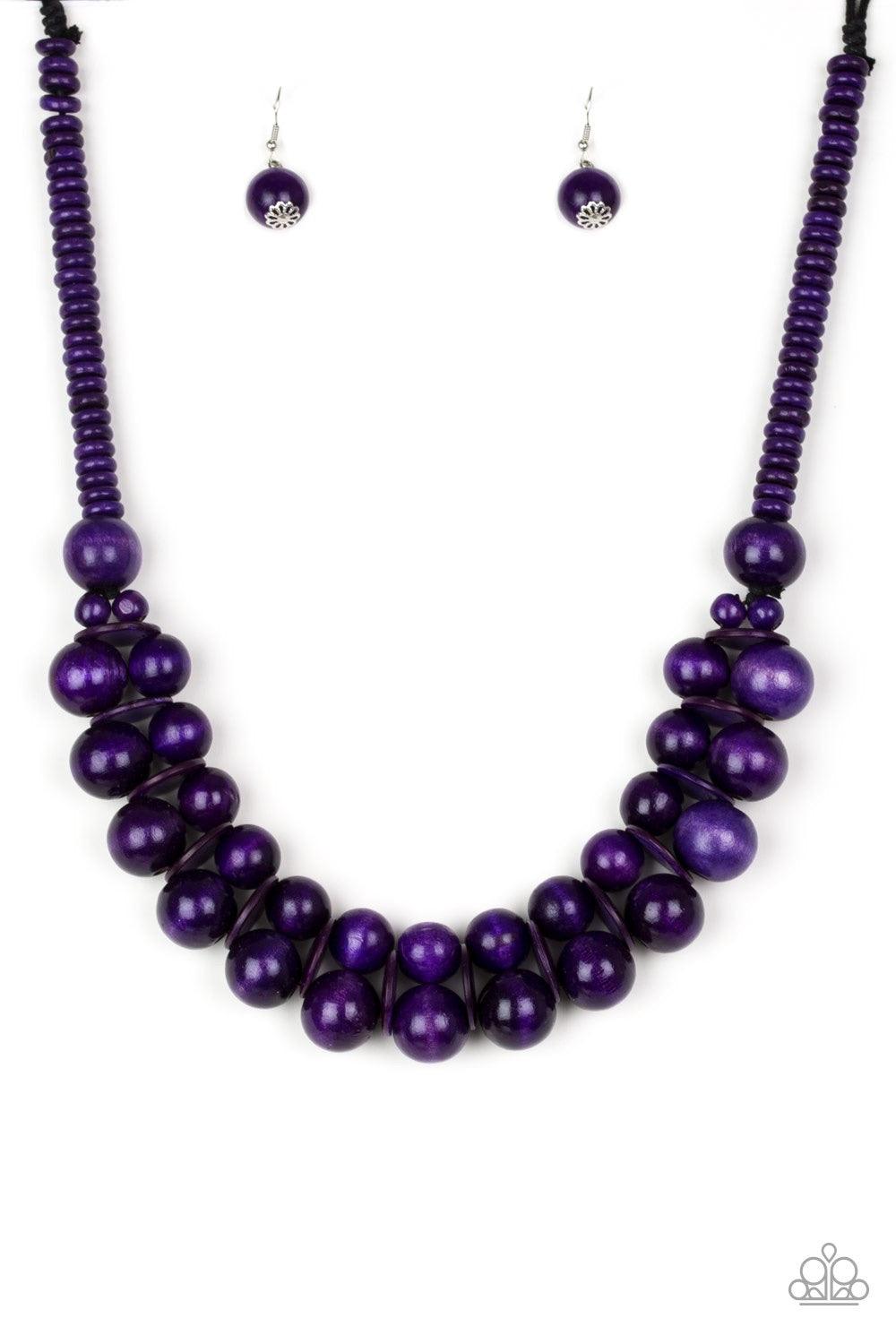 Paparazzi Accessories Caribbean Cover Girl - Purple Brushed in a distressed finish, vivacious purple wooden beads and discs join below the collar for a summery look. Features a button loop closure. Jewelry