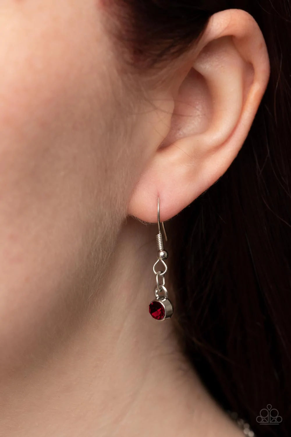 Paparazzi Accessories Sonata Swing - Red Dainty white rhinestones are sprinkled across silver vine-like filigree that whirls around an oval red gem center inside of a studded silver frame, resulting in a whimsical pendant at the bottom of a silver chain.