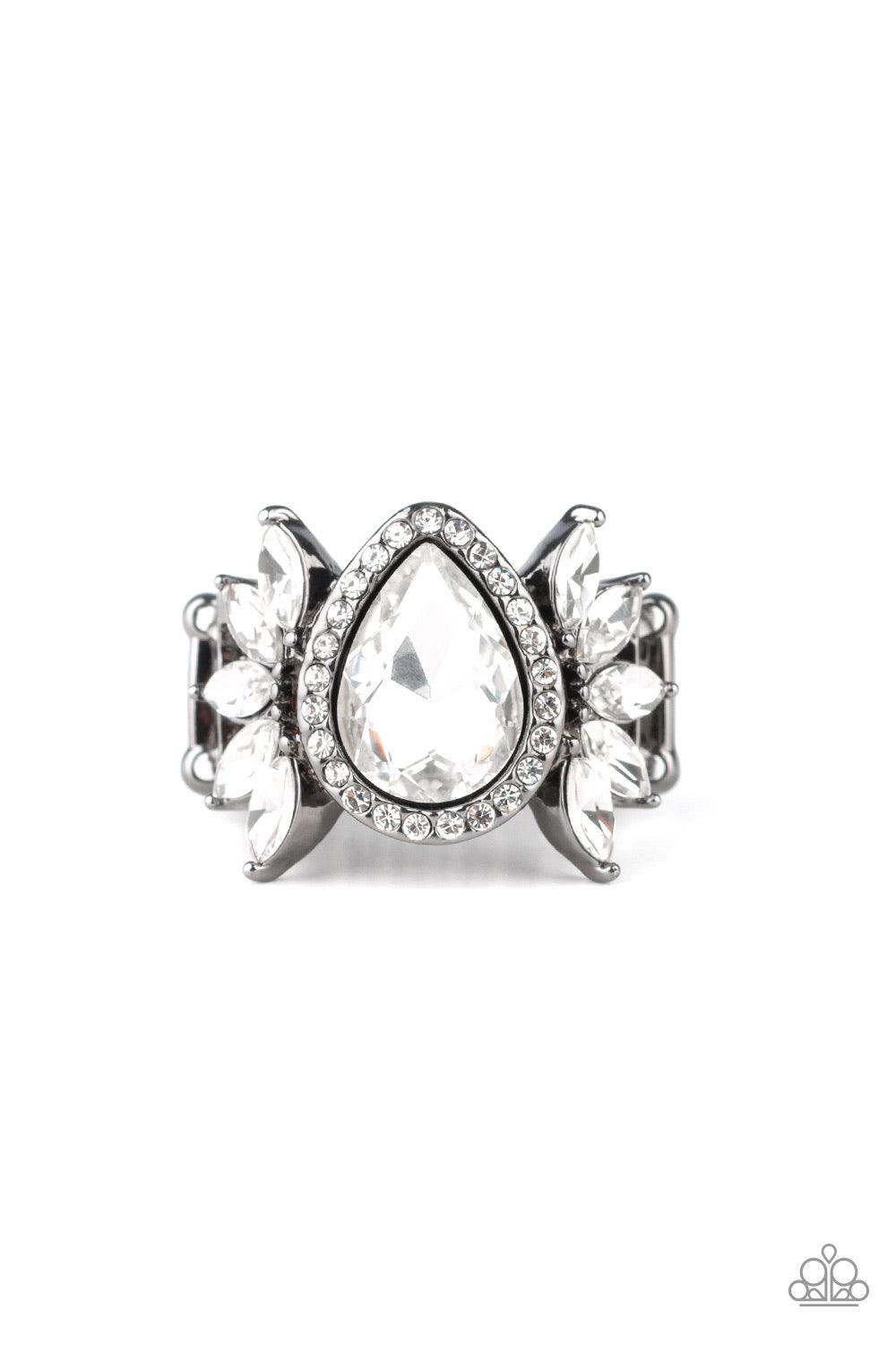 Paparazzi Accessories Really Regal - Black An oversized white teardrop rhinestone is nestled between two gunmetal frames radiating with fans of white marquise-style rhinestones. Features a stretchy band for a flexible fit. Jewelry