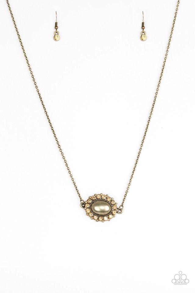 Paparazzi Accessories Stardom Shine - Brass A pearly brass bead is pressed into a dazzling topaz rhinestone encrusted frame, creating a refined pendant below the collar. Sold as one individual necklace. Includes one pair of matching earrings. Jewelry