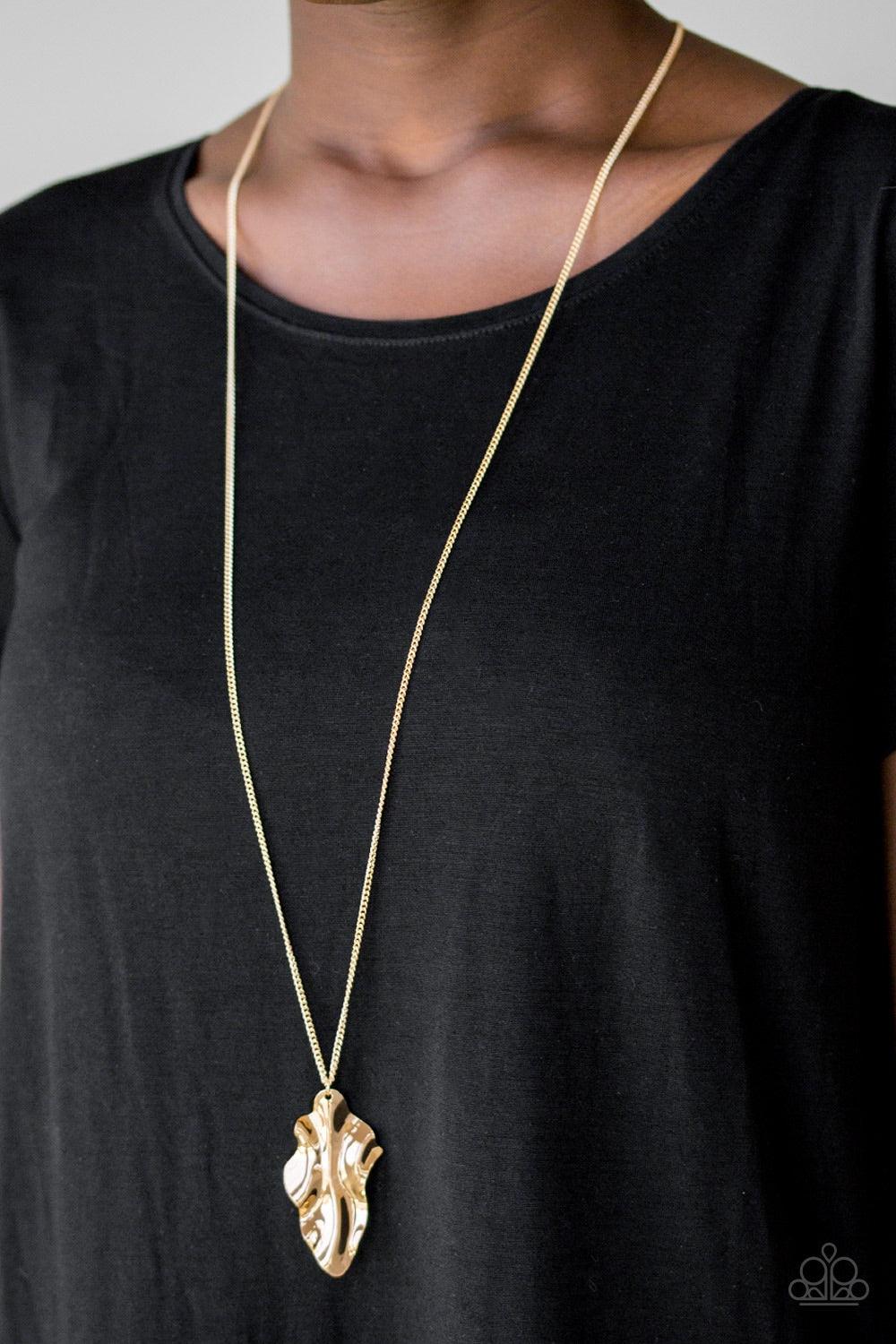 Paparazzi Accessories Fiercely Fall - Gold An elongated gold chain gives way to a rippling gold leaf-like pendant for a seasonal look. Features an adjustable clasp closure. Jewelry