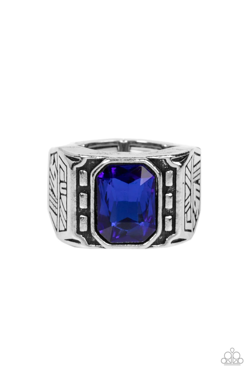 Paparazzi Accessories Metro Magnate - Blue A majestic emerald cut blue rhinestone is pressed into the center of a rectangular studded silver frame flanked by geometric texture, creating an edgy centerpiece atop the finger. Features a stretchy band for a f