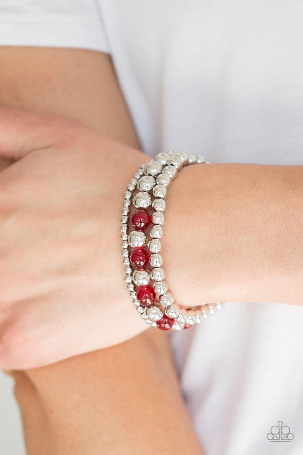 Paparazzi Accessories Always On The Glow - Red Infused with glowing red moonstones, shiny silver beads are threaded along stretchy bands for a whimsical look. Sold as one set of three bracelets. Jewelry