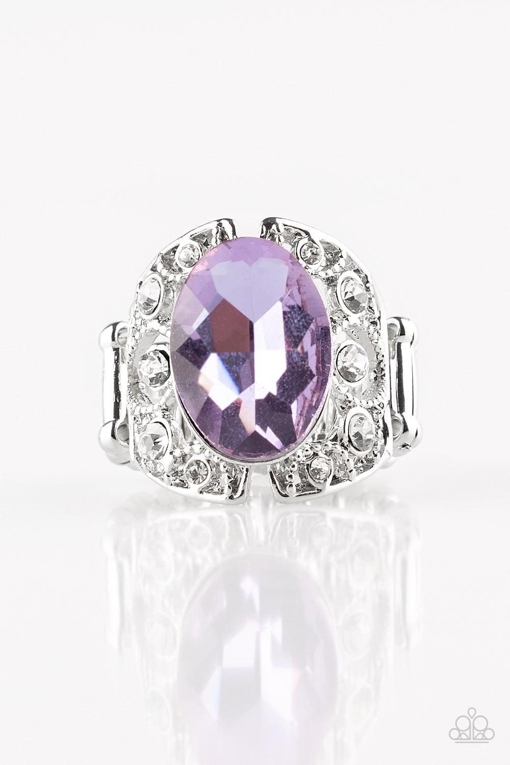 Paparazzi Accessories Queen of Hustle ~Purple A glassy purple gem sits atop a frilly filigree backdrop radiating with glassy white rhinestones for a regal look. Features a stretchy band for a flexible fit.