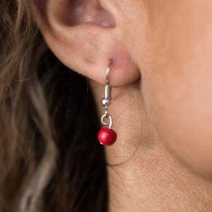 Paparazzi Accessories Texas Tempest - Red Dainty red and brown stone beading trickles from three shimmery silver chains. A hammered silver disc hangs from the uppermost chain as a large silver pendant swings from the bottom in a wanderlust fashion. Featur