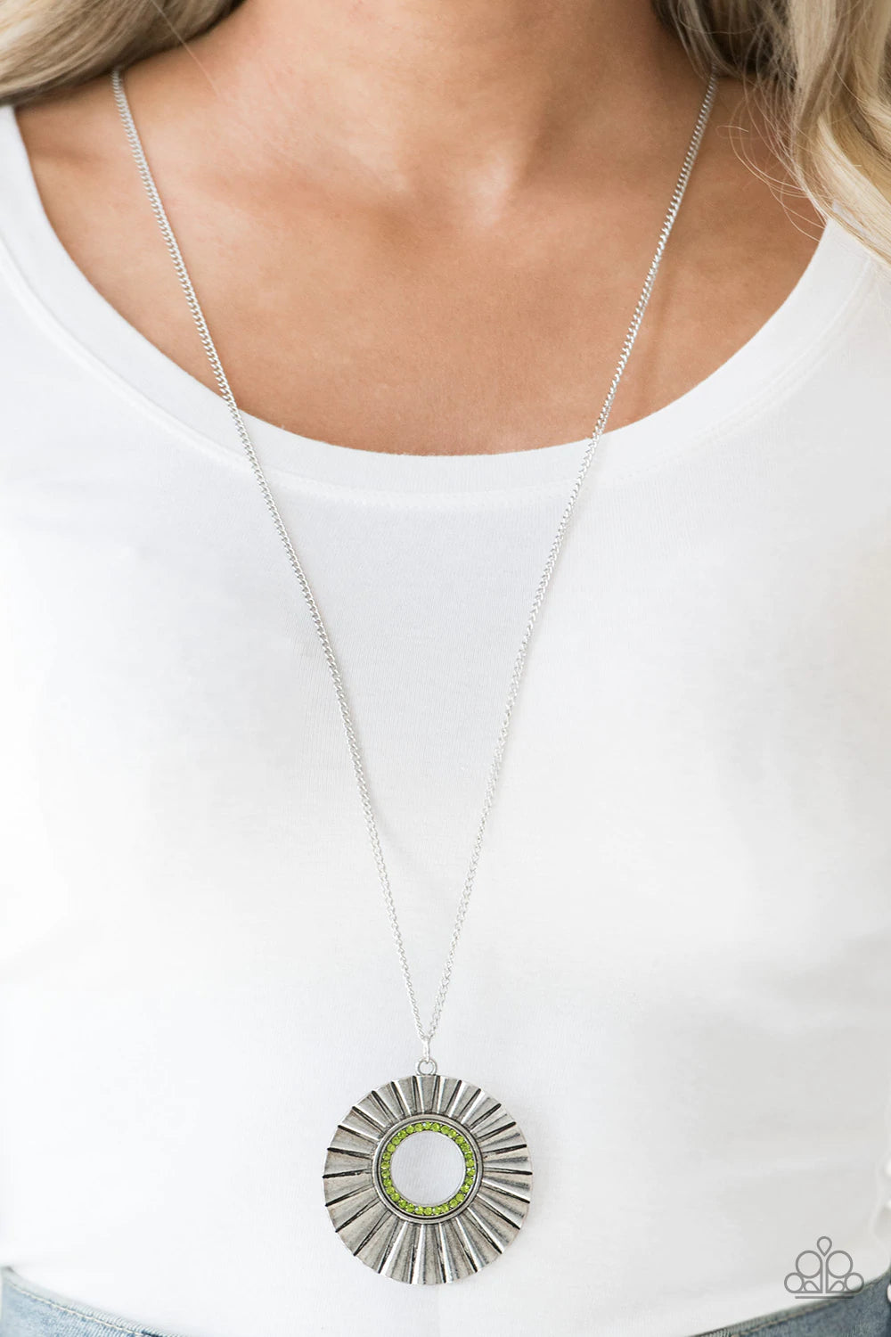 Paparazzi Accessories Chicly Centered - Green Brushed in a gritty antiqued finish, a rippling silver frame flares from a green rhinestone encrusted center for an edgy look. Features an adjustable clasp closure. Sold as one individual necklace. Includes on
