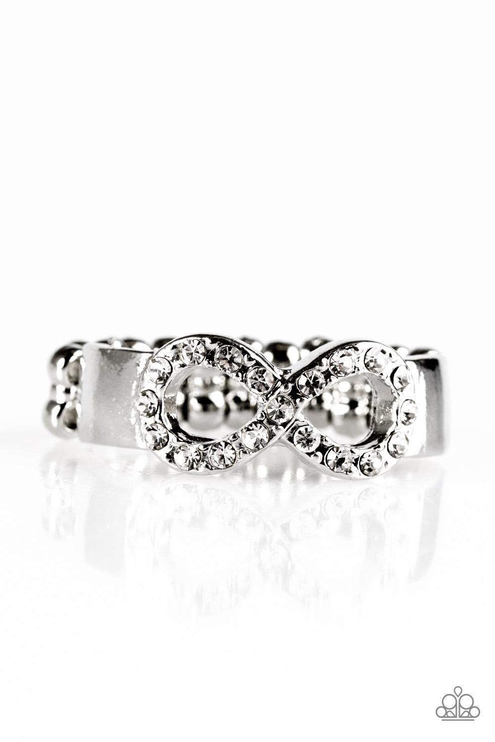 Paparazzi Accessories Once Upon A TIMELESS - Silver Encrusted in smoky rhinestones, a silver infinity loops across the finger in a timeless fashion. Features a dainty stretchy band for a flexible fit. Jewelry