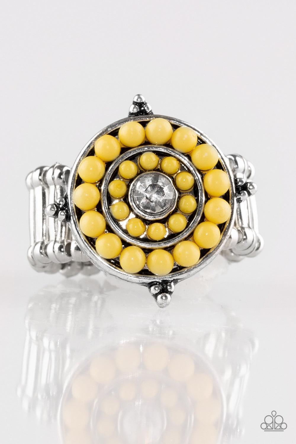 Paparazzi Accessories Hide Tide Pool Party - Yellow Vivacious yellow beads spin around a glittery white rhinestone center, creating a bright and summery centerpiece atop the finger. Features a stretchy band for a flexible fit. Jewelry