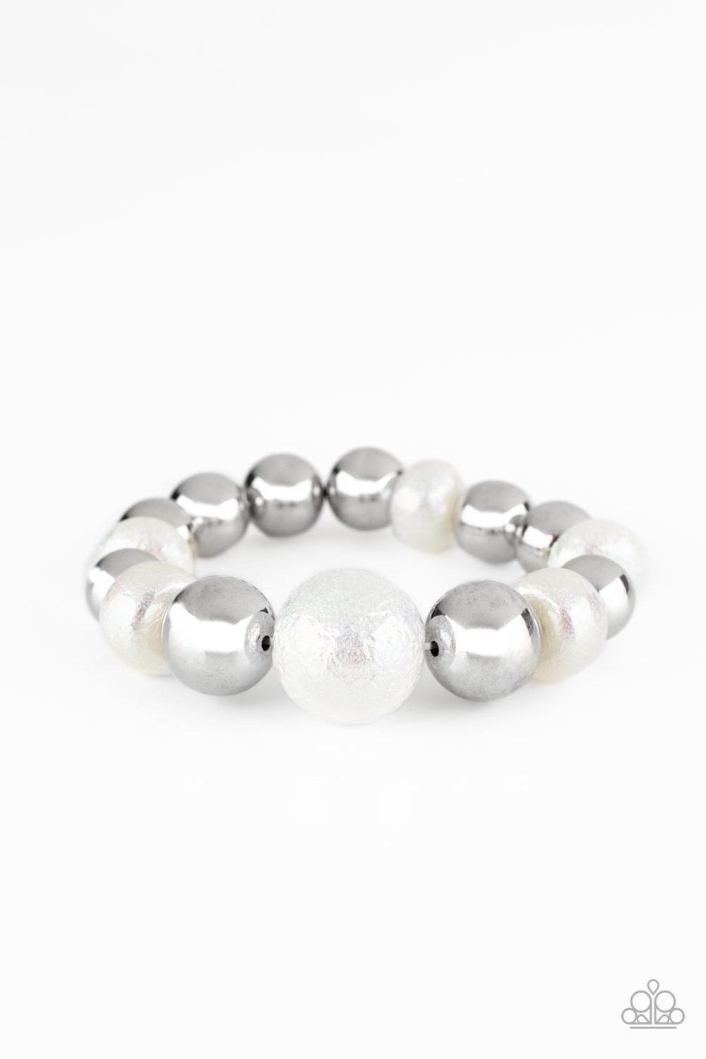 Paparazzi Accessories Starstruck Shimmer - White Brushed in a stellar iridescence, hammered pearly beads and classic silver beads gradually increase in size as they slide along a stretchy band around the wrist for a glamorous look. Sold as one individual