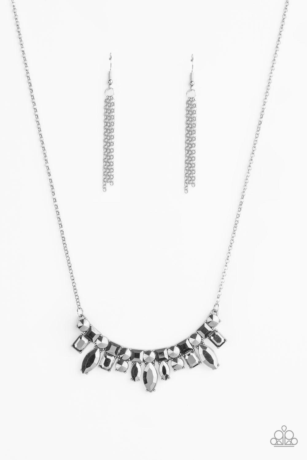 Paparazzi Accessories Wish Upon a ROCK STAR - Silver A collision of round, square, emerald, and marquise cut hematite rhinestones coalesce into a dazzling pendant below the collar for an edgy elegance. Features an adjustable clasp closure. Sold as one ind