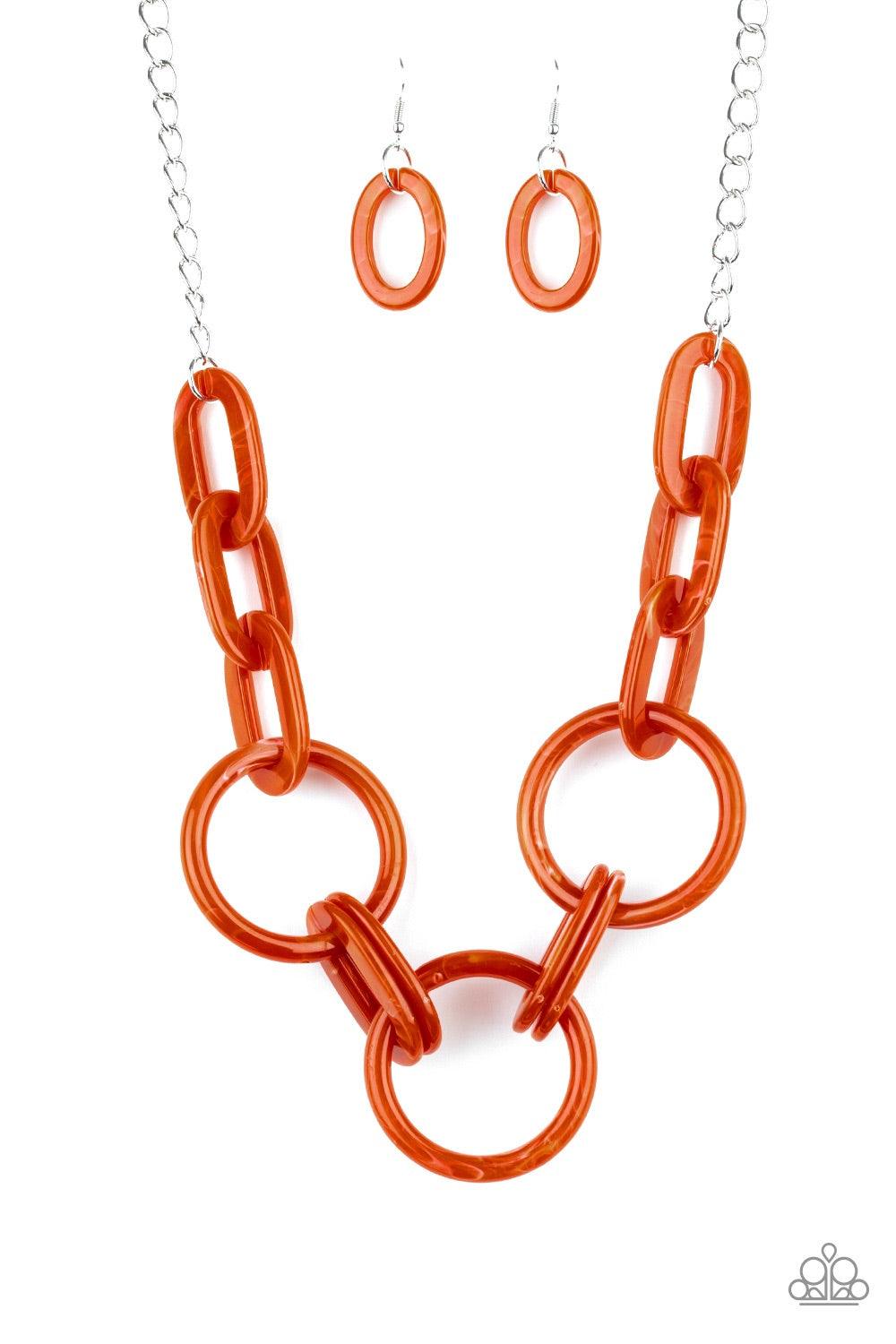 Paparazzi Accessories Turn Up The Heat - Orange Suspended from a shimmery silver chain, a collision of orange acrylic links connect below the collar in a statement-making fashion. Features an adjustable clasp closure. Jewelry
