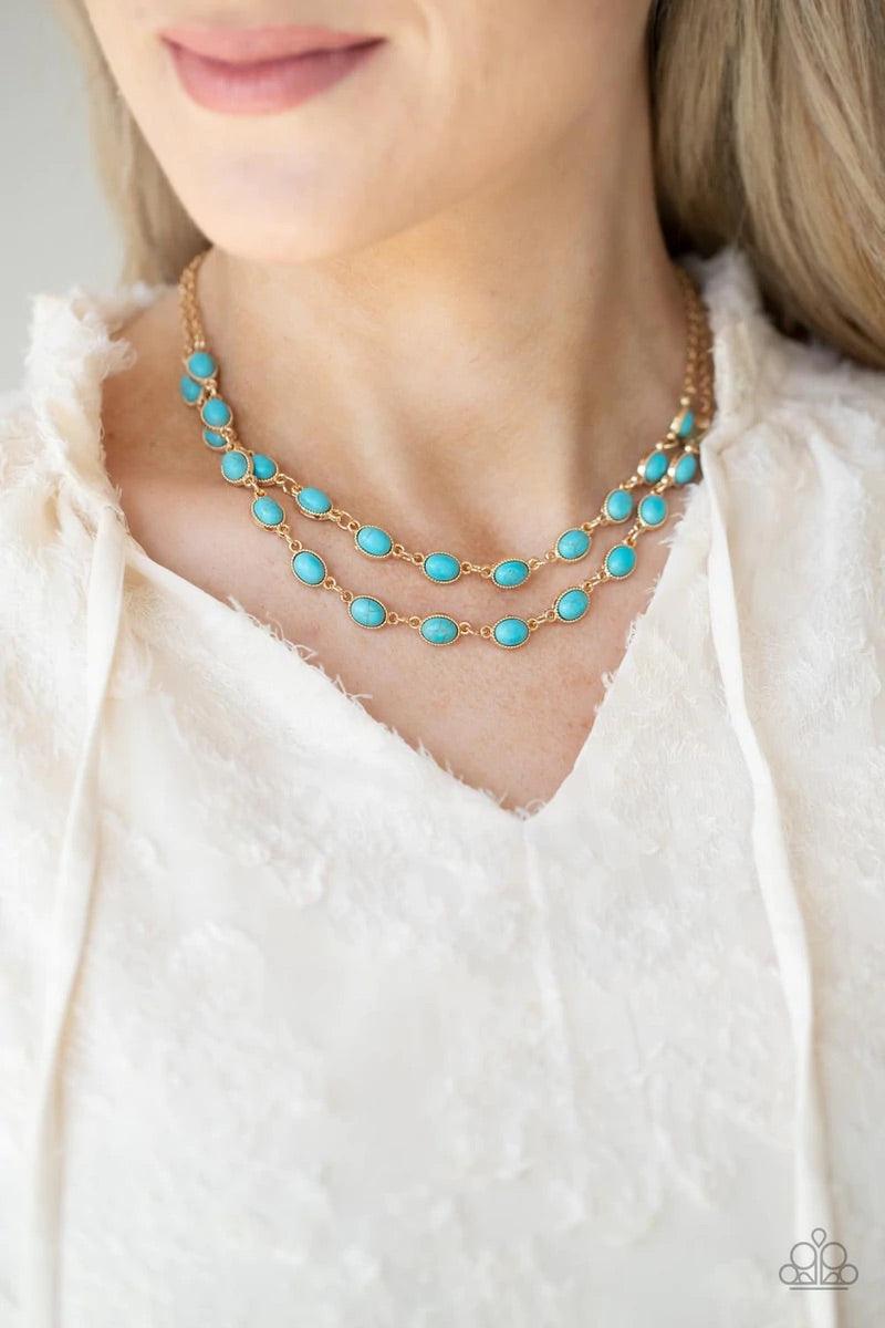 Paparazzi Accessories Sahara Safari - Blue Encased in studded gold frames, two rows of oval turquoise stones delicately connect below the collar for a seasonal flair. Features an adjustable clasp closure. Sold as one individual necklace. Includes one pair