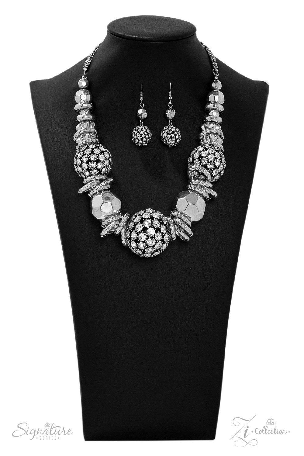 Paparazzi Accessories The Barbara 💗ZiCollection $25💗 Oversized beads encrusted in rhinestones collide with textured silver hoops and large faceted silver beads in this jaw-dropping piece. The metallic accents and shimmering spheres increase in size as t