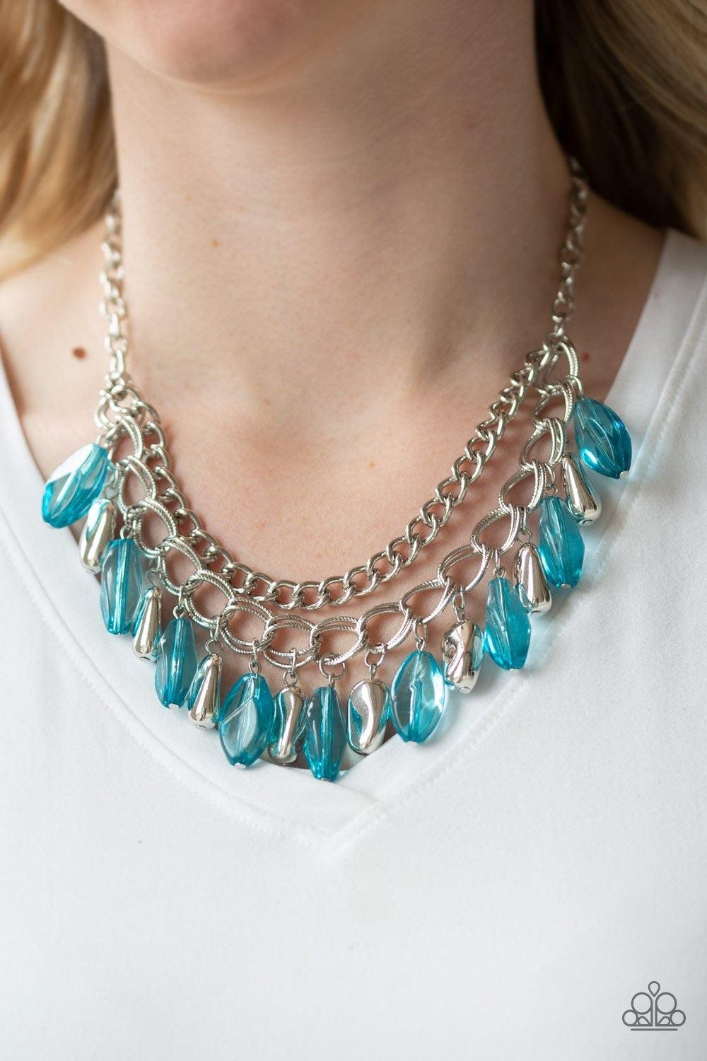 Paparazzi Accessories Spring Daydream - Blue Infused with a row of thick silver chain, faceted silver and glassy blue beads swing from the bottom of ornate silver links, creating a vivacious fringe below the collar. Features an adjustable clasp closure. J