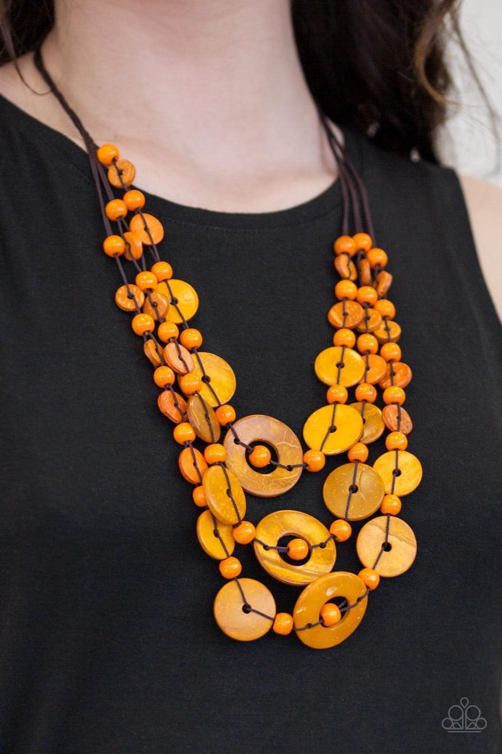 Paparazzi Accessories Bali Boardwalk - Orange Brushed in a distressed finish, vivacious orange wooden beads and discs trickle along three strands, creating a summery look down the chest. Features a button loop closure. Jewelry