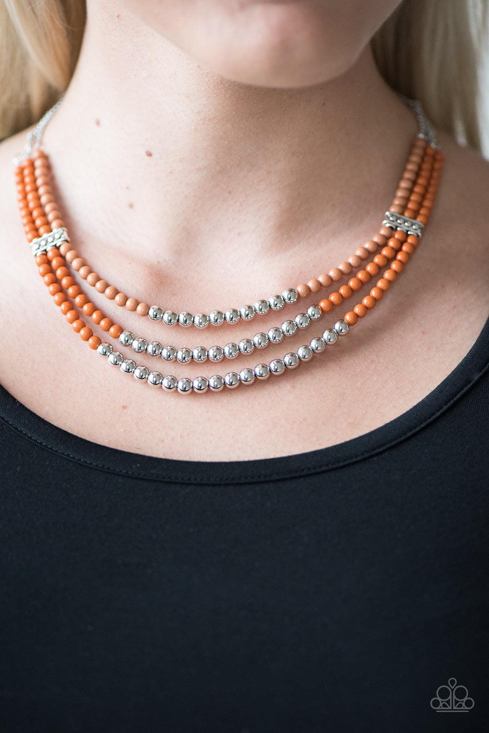 Paparazzi Accessories Just BEAD You - Orange Secured in place by two silver accent pieces, three colorful strands of orange, brown, and silver beading layer below the collar in a seasonal fashion. Features an adjustable clasp closure. Jewelry