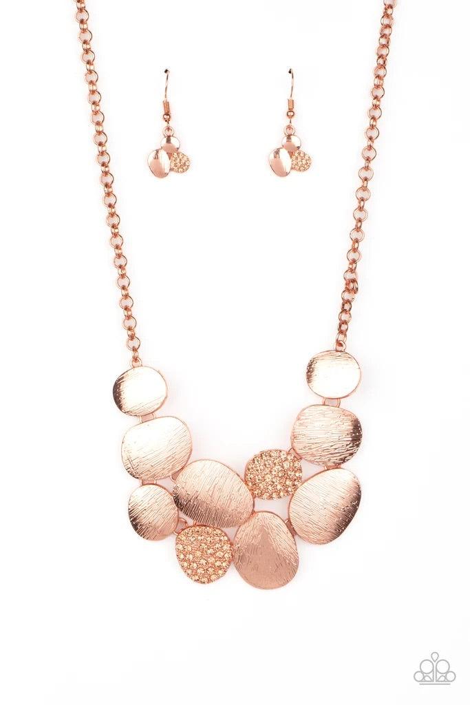 Paparazzi Accessories A Hard LUXE Story - Copper Featuring imperfect oval shapes, a series of delicately scratched and peach rhinestone encrusted shiny copper frames connect into a clustered pendant below the collar for a refined flair. Features an adjust