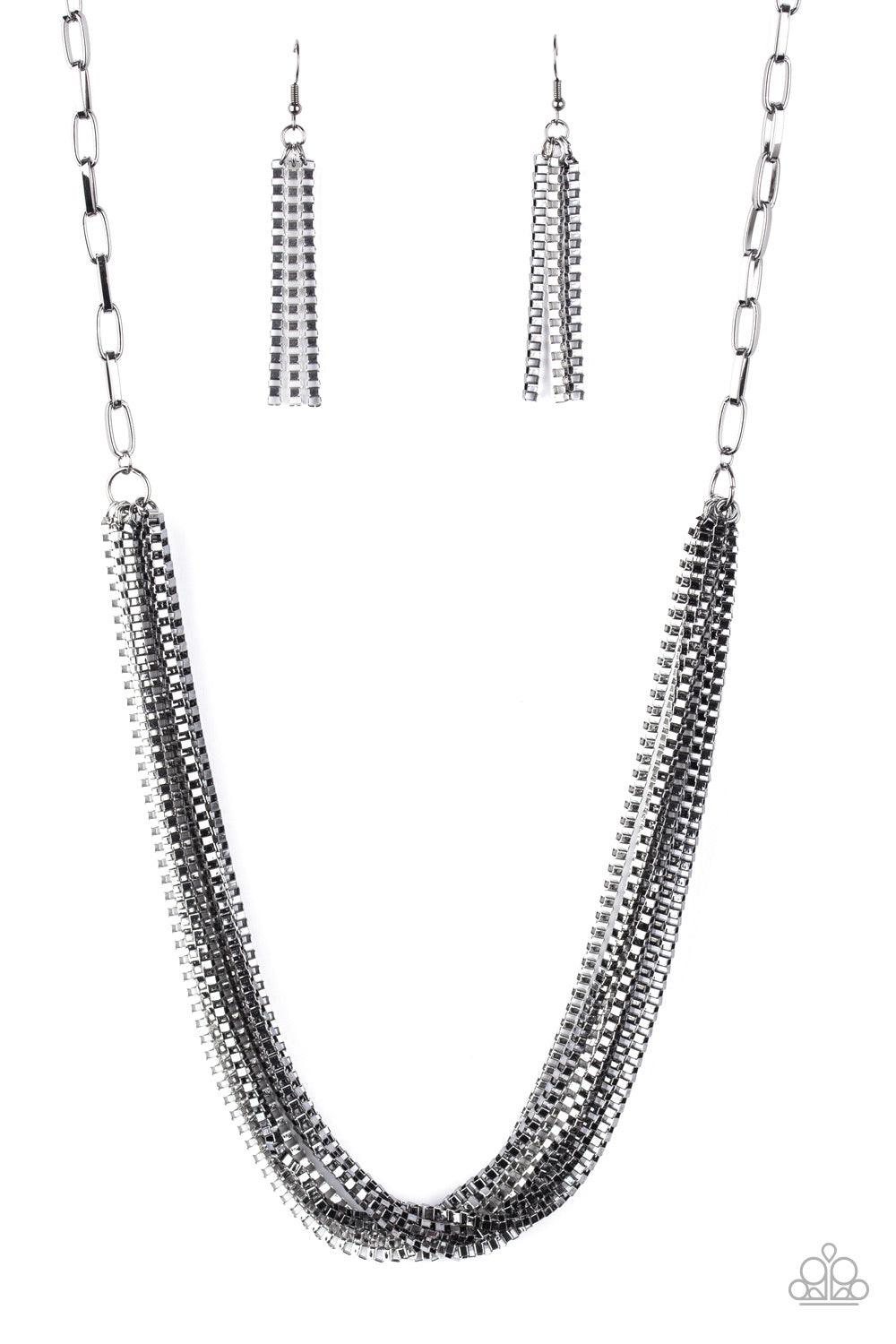 Paparazzi Accessories Beat Box Queen - Black Attached to a thick gunmetal chain, a collision of silver and gunmetal box chains layer below the collar for an edgy mix. Features an adjustable clasp closure. Sold as one individual necklace. Includes one pair