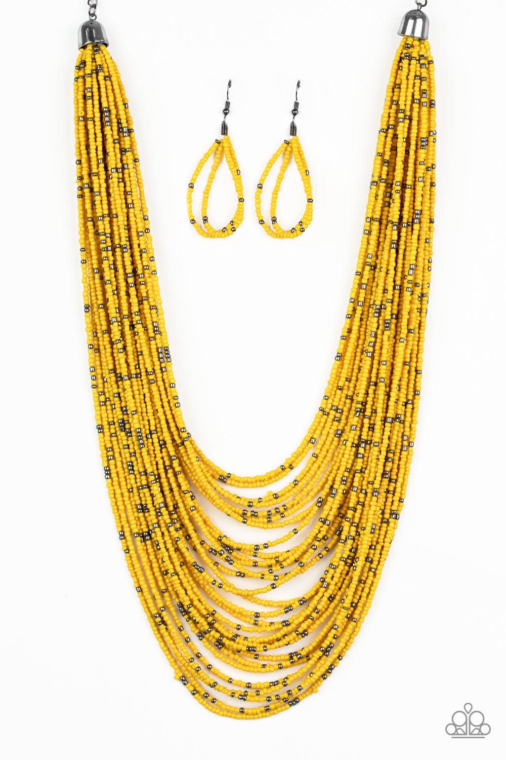 Paparazzi Accessories Rio Rainforest - Yellow Suspended between two gunmetal fittings, row after row of countless strands of yellow seed beads layer below the collar. Dainty gunmetal seed beads are sprinkled across the strands for a seasonal finish. Featu