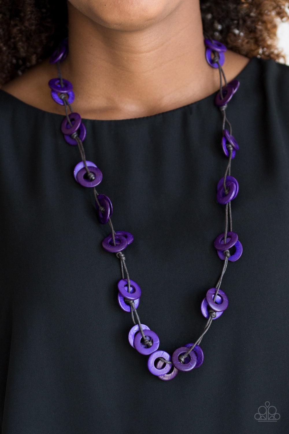 Paparazzi Accessories Waikiki Winds ~Purple Shiny brown cording knots around vivacious purple wooden discs, creating a colorful display across the chest. Features a button loop closure. Sold as one individual necklace. Includes one pair of matching earrin
